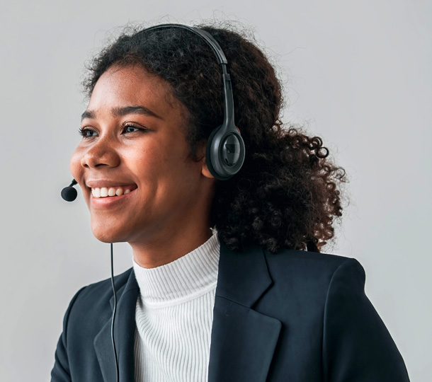 A smiling IT professional with a headset